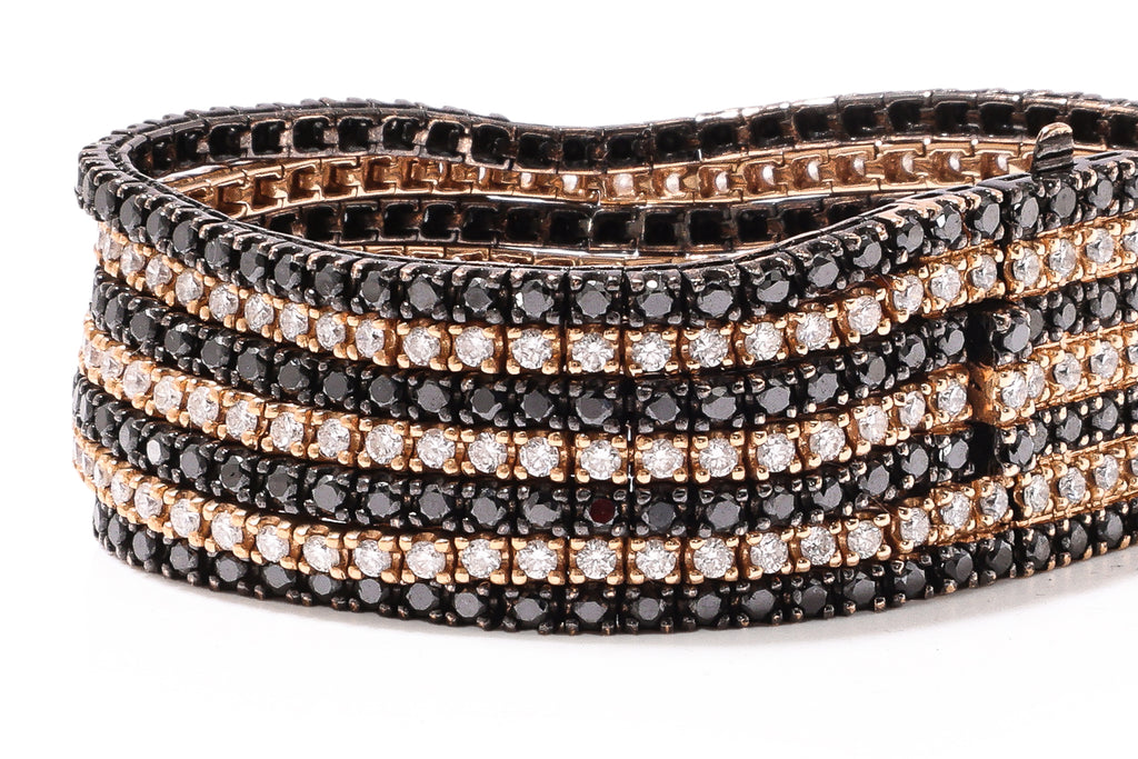 A MULTI-ROW DIAMOND AND BLACK DIAMOND BRACELET WITH MATCHING RING