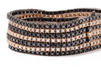 A MULTI-ROW DIAMOND AND BLACK DIAMOND BRACELET WITH MATCHING RING