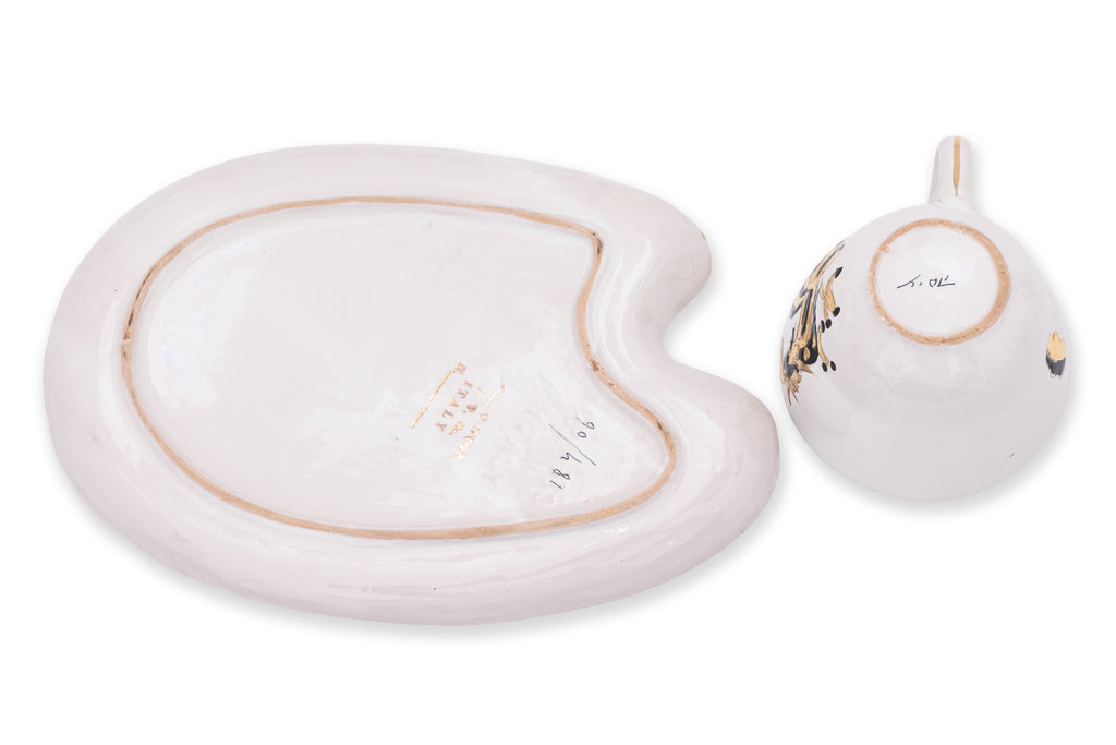A SET OF FOUR ITALIAN CERAMIC CUPS AND SAUCERS