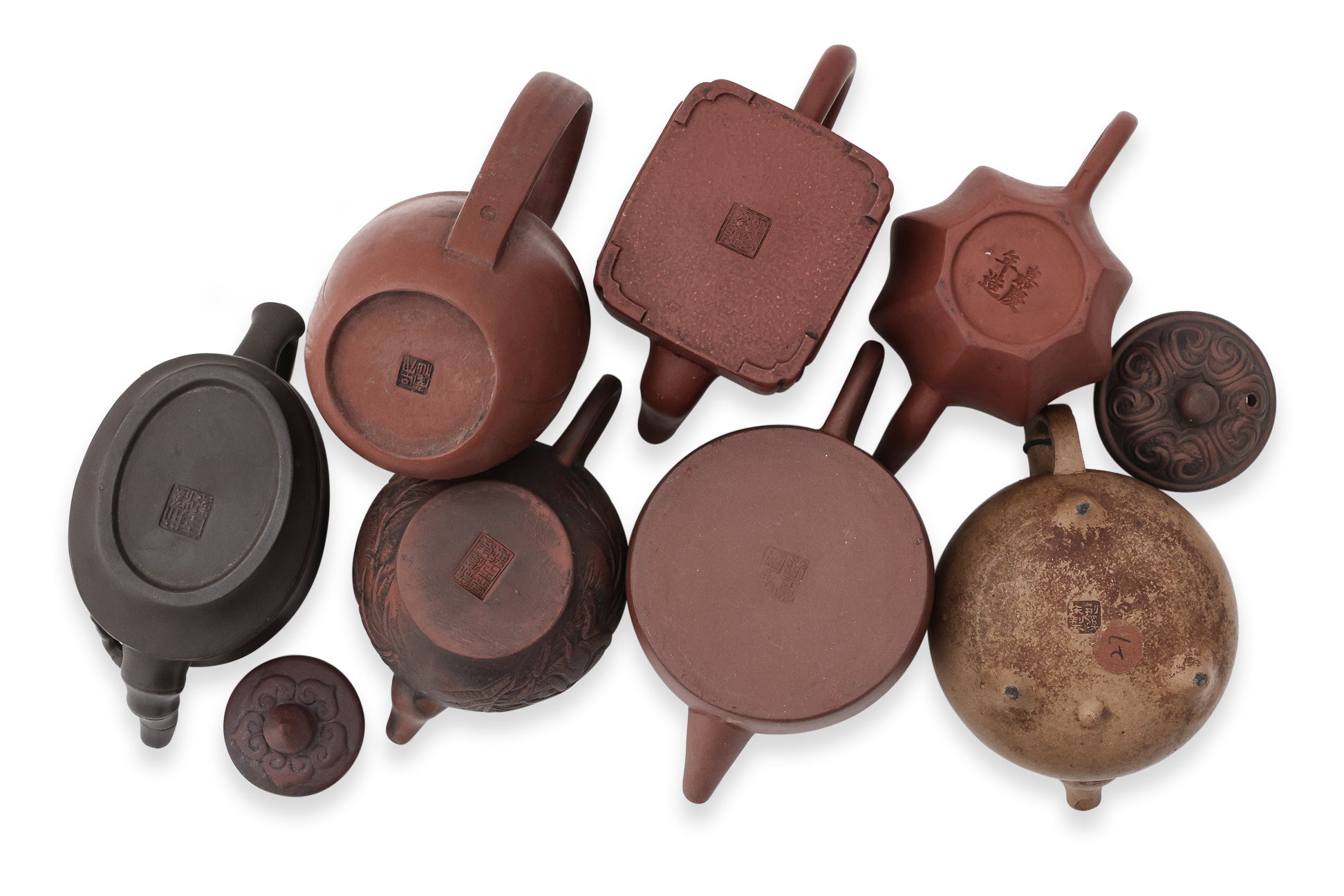 A GROUP OF EIGHT YIXING ZISHA POTTERY TEAPOTS