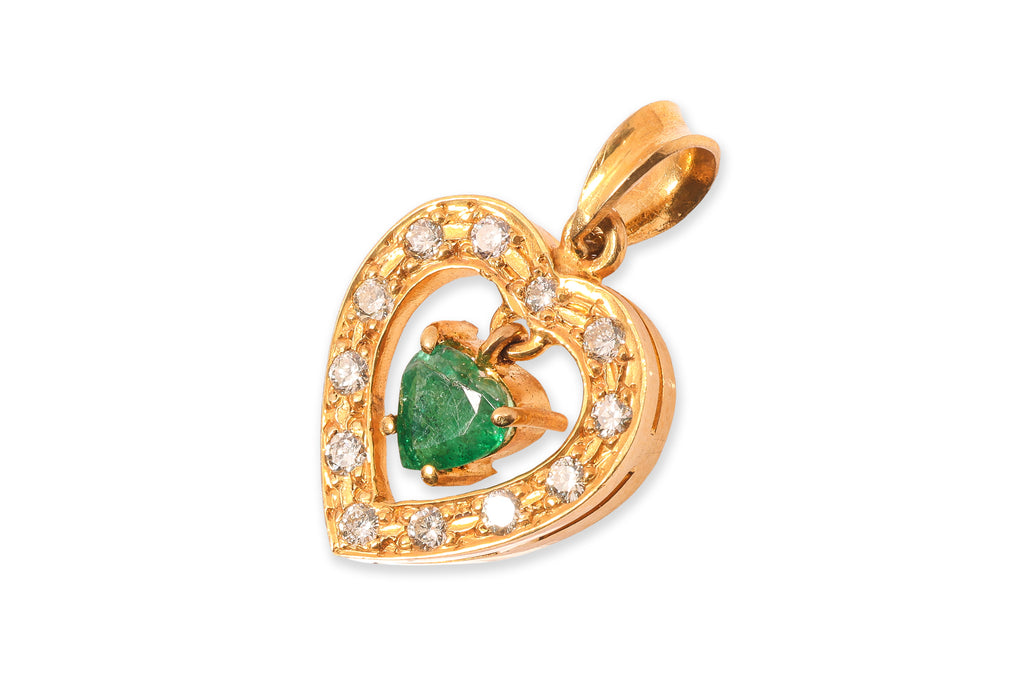 A HIGH KARAT GOLD EMERALD AND DIAMOND 'HEART' PENDANT