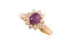 A STAR RUBY AND DIAMOND CLUSTER RING