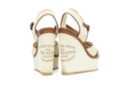 LOUIS VUITTON - A PAIR OF 'ARTICLES DE VOYAGE' SUNLIGHT WEDGE SANDALS