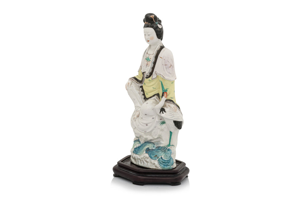 A POLYCHROME-ENAMELLED PORCELAIN FIGURE OF A WOMAN AND BIRD