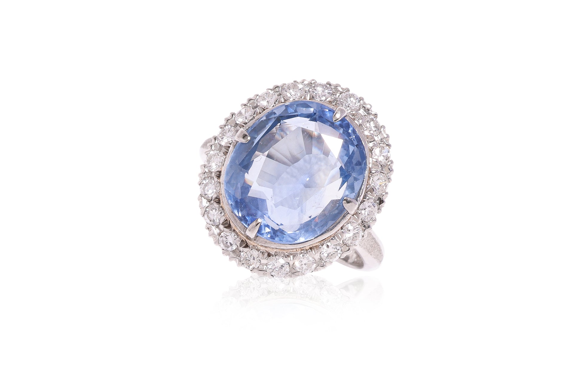 A UNHEATED SAPPHIRE AND DIAMOND 'HALO' RING
