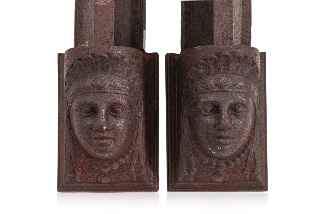 A PAIR OF FRENCH CAST IRON FIRE DOGS