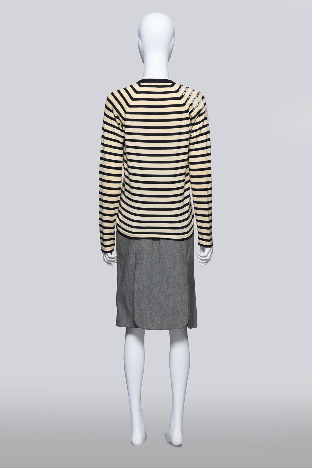 JOHN GALLIANO - A STRIPED CARDIGAN AND GREY SKIRT ENSEMBLE