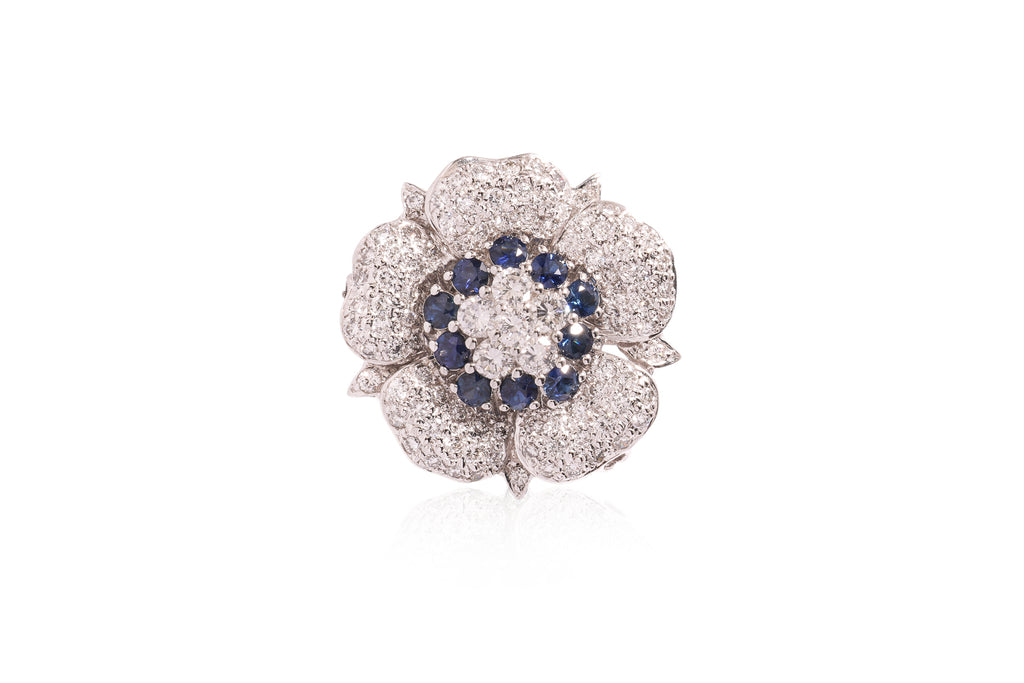 A DIAMOND AND SAPPHIRE 'FLOWER' PENDANT/BROOCH
