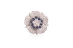 A DIAMOND AND SAPPHIRE 'FLOWER' PENDANT/BROOCH