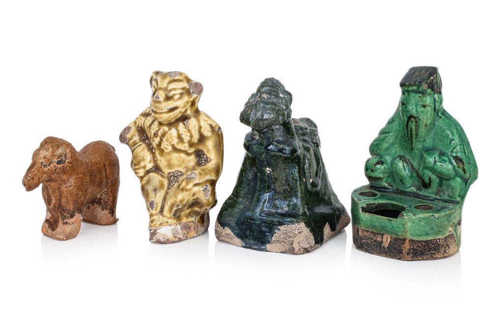 A GROUP OF SIX POTTERY FIGURES