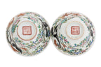 A GROUP OF FIVE FAMILLE ROSE 'MAGPIE' TEA BOWLS