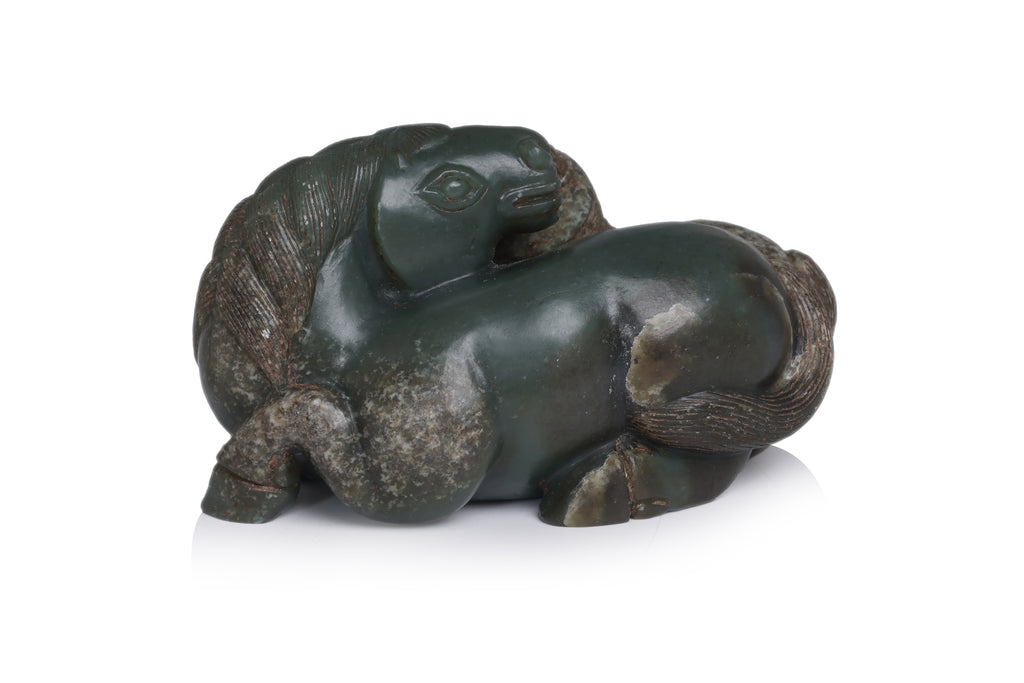 A CARVED GREEN JADE HORSES GROUP