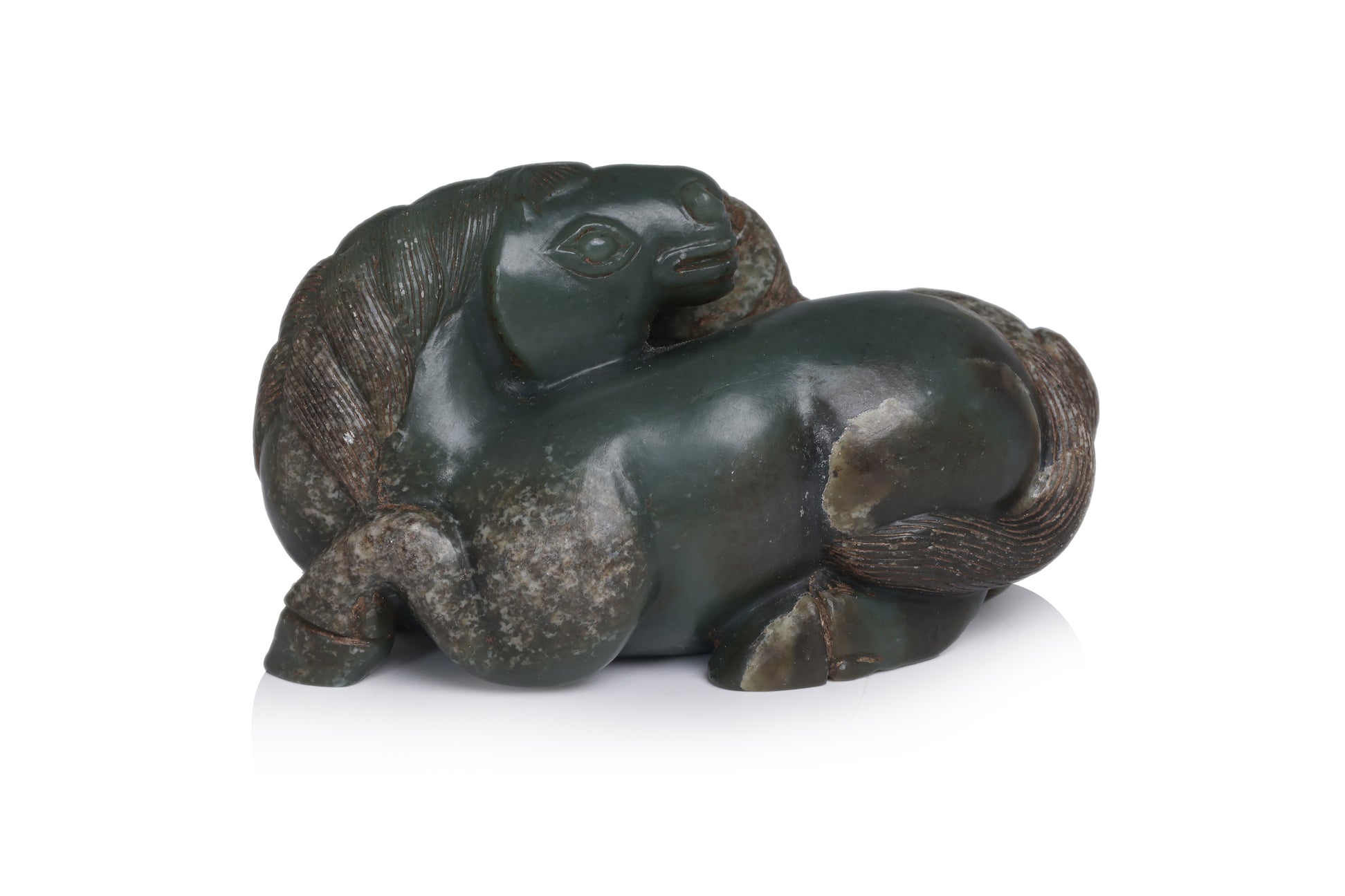 A CARVED GREEN JADE HORSES GROUP