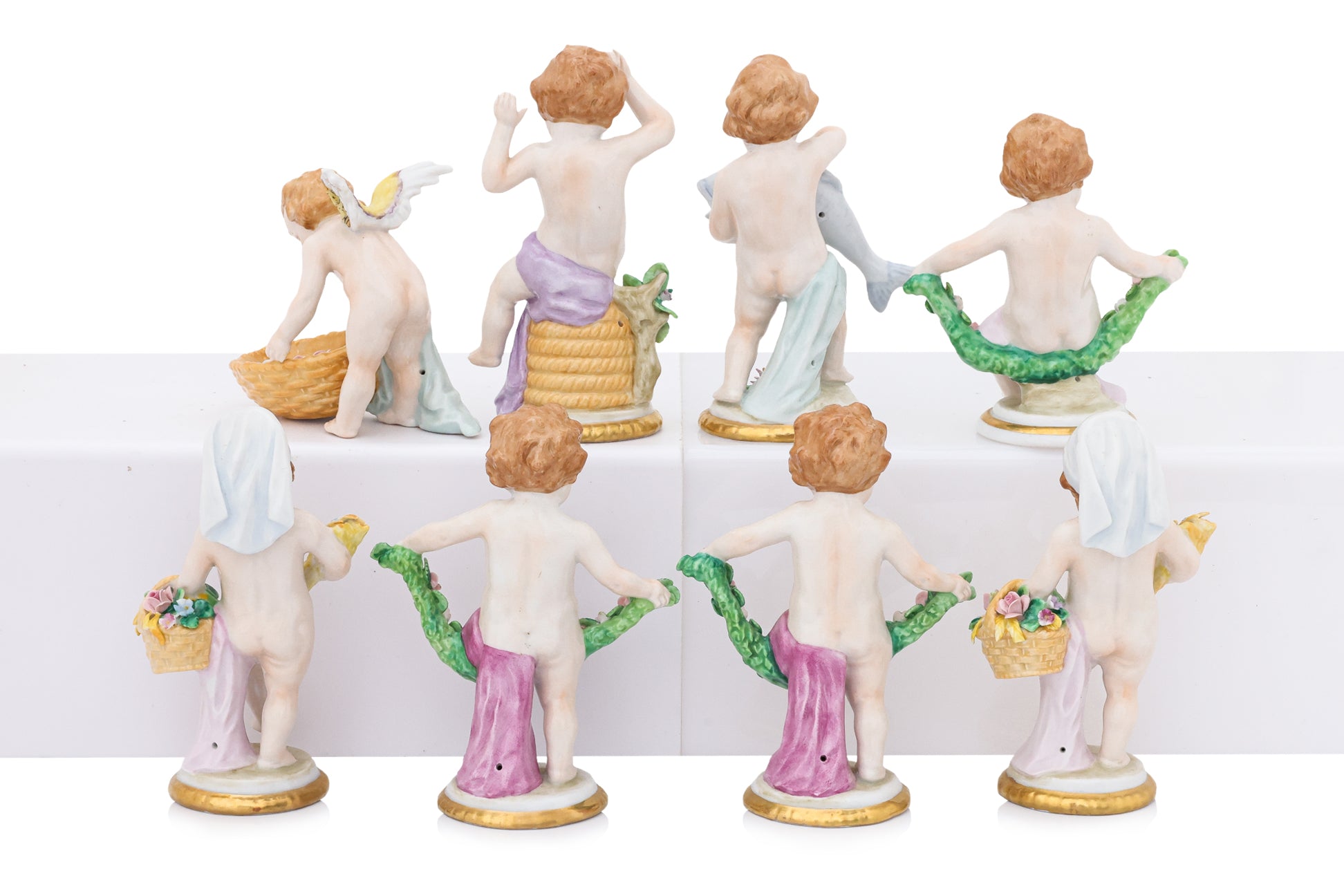 A GROUP OF EIGHT SITZENDORF PORCELAIN FIGURES OF PUTTI