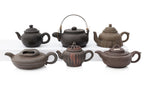 A GROUP OF SIX YIXING ZISHA POTTERY TEAPOTS