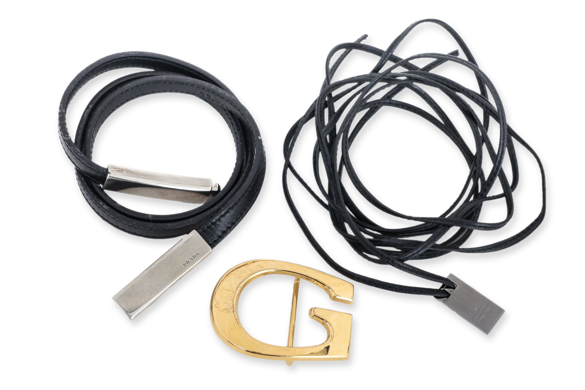 PRADA & GUCCI - TWO LEATHER BELTS AND A BUCKLE
