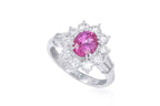 A PINK SAPPHIRE AND DIAMOND CLUSTER RING