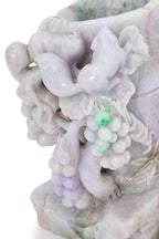 A JADEITE MODEL OF A BAMBOO WITH SQUIRRELS AND GRAPES