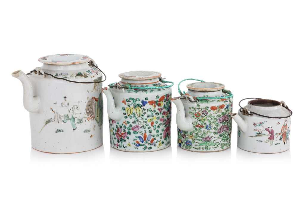 A GROUP OF FOUR FAMILLE ROSE PORCELAIN TEAPOTS