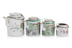 A GROUP OF FOUR FAMILLE ROSE PORCELAIN TEAPOTS