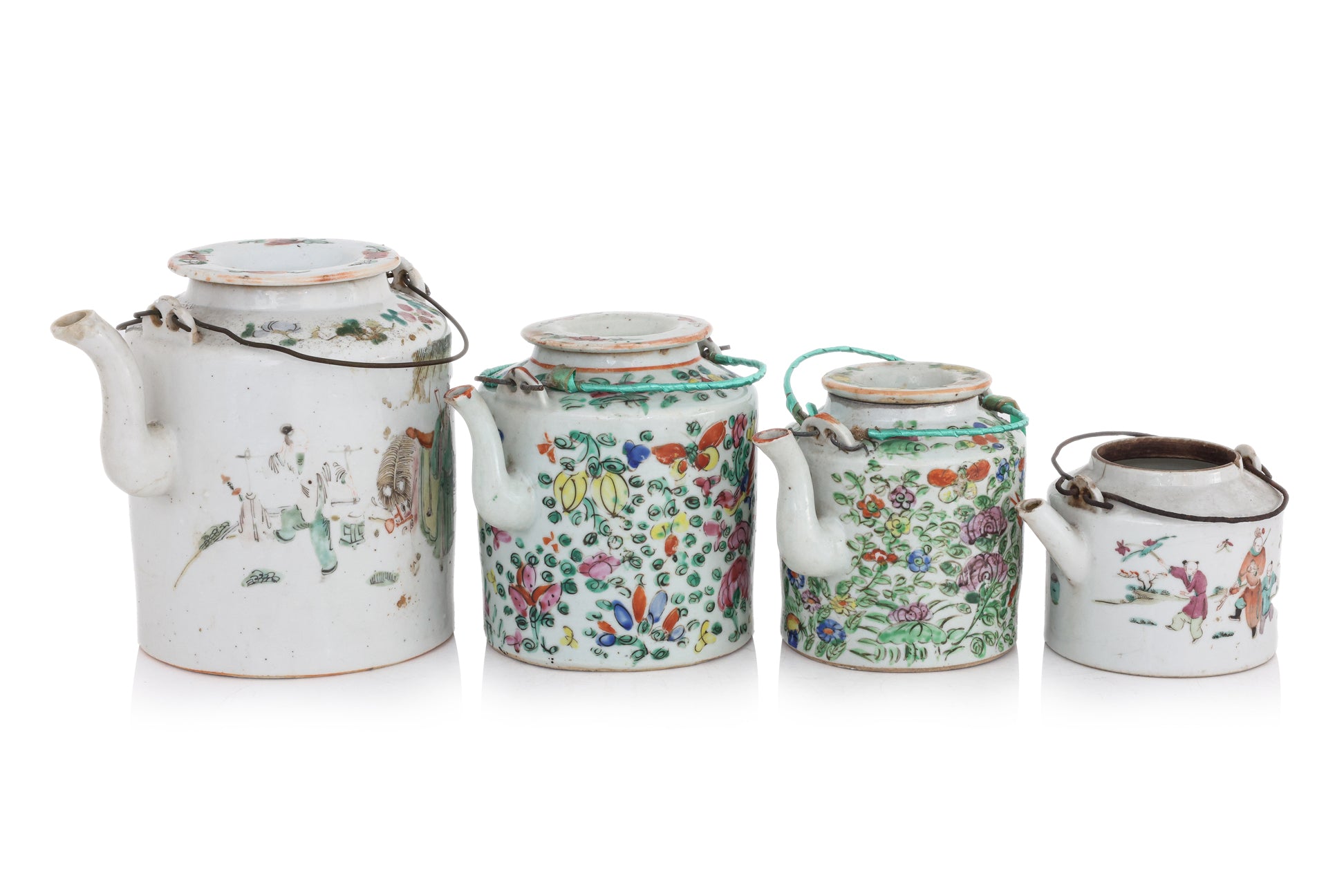 A GROUP OF FOUR FAMILLE ROSE PORCELAIN TEAPOTS