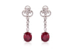 A PAIR OF LEAD GLASS FILLED RUBY AND DIAMOND EARRINGS