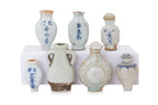 A GROUP OF SEVEN MINIATURE PORCELAIN BOTTLES