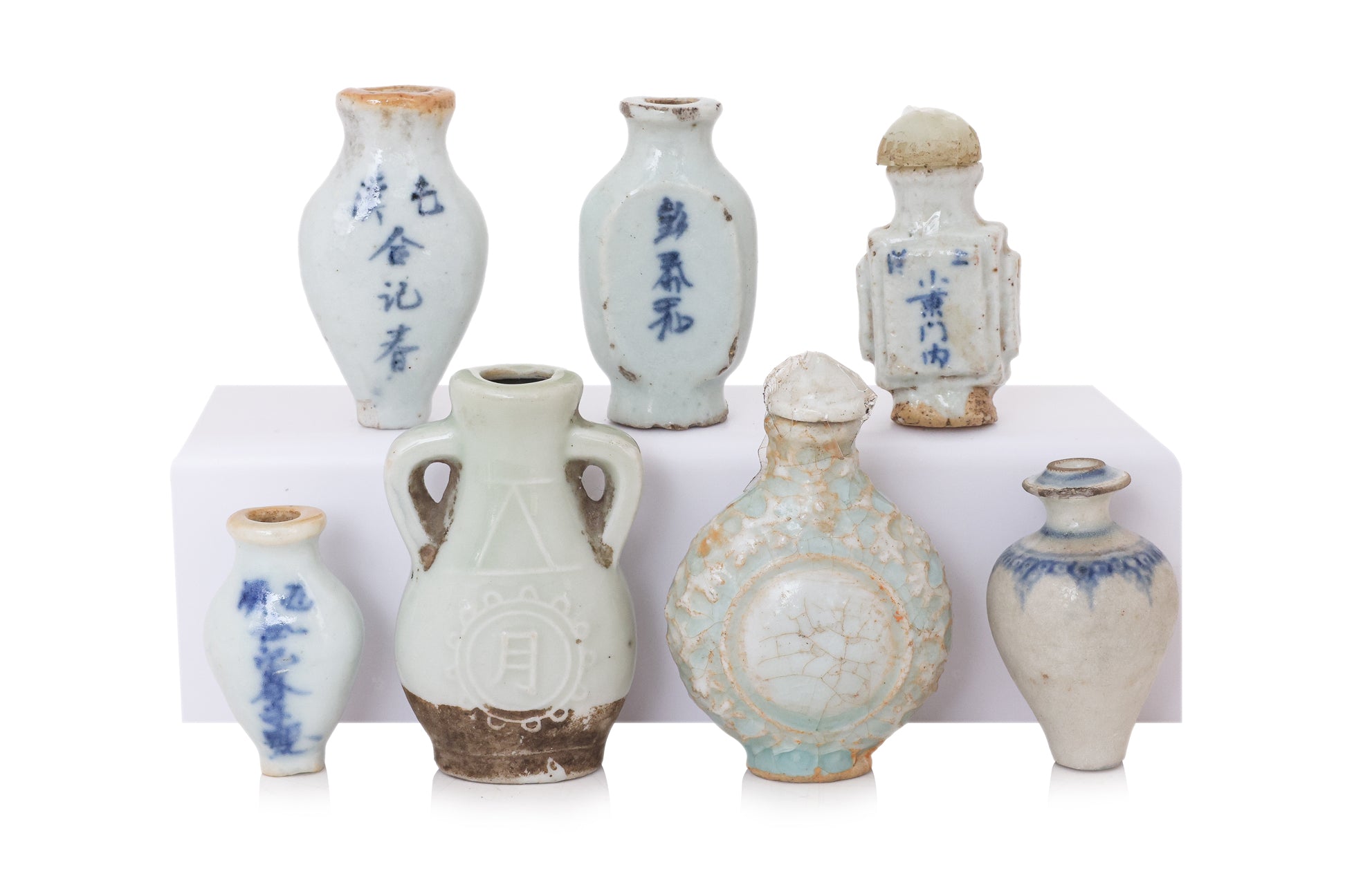 A GROUP OF SEVEN MINIATURE PORCELAIN BOTTLES