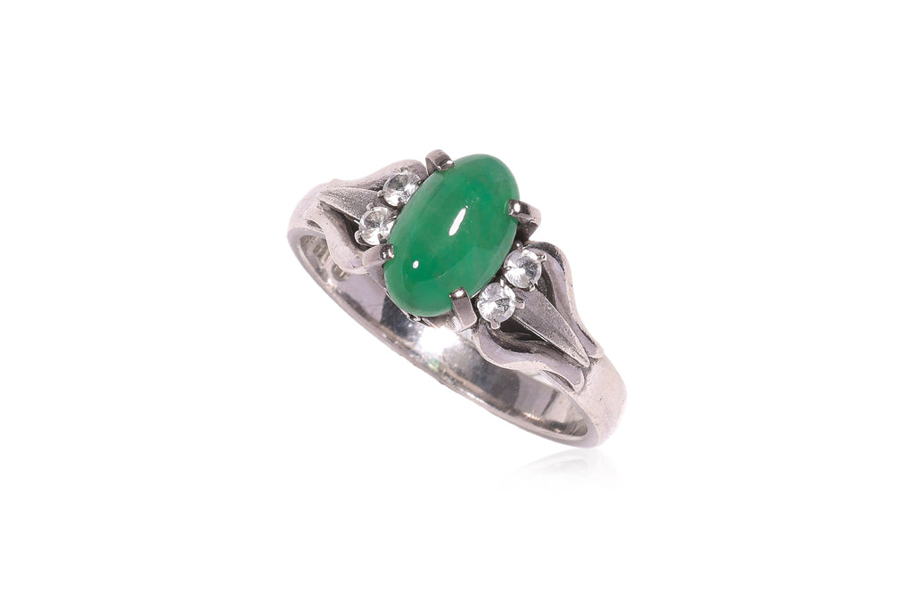 A JADEITE AND WHITE STONE RING