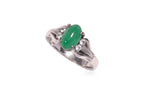 A JADEITE AND WHITE STONE RING