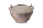 A TWIN HANDLED EARTHENWARE JAR