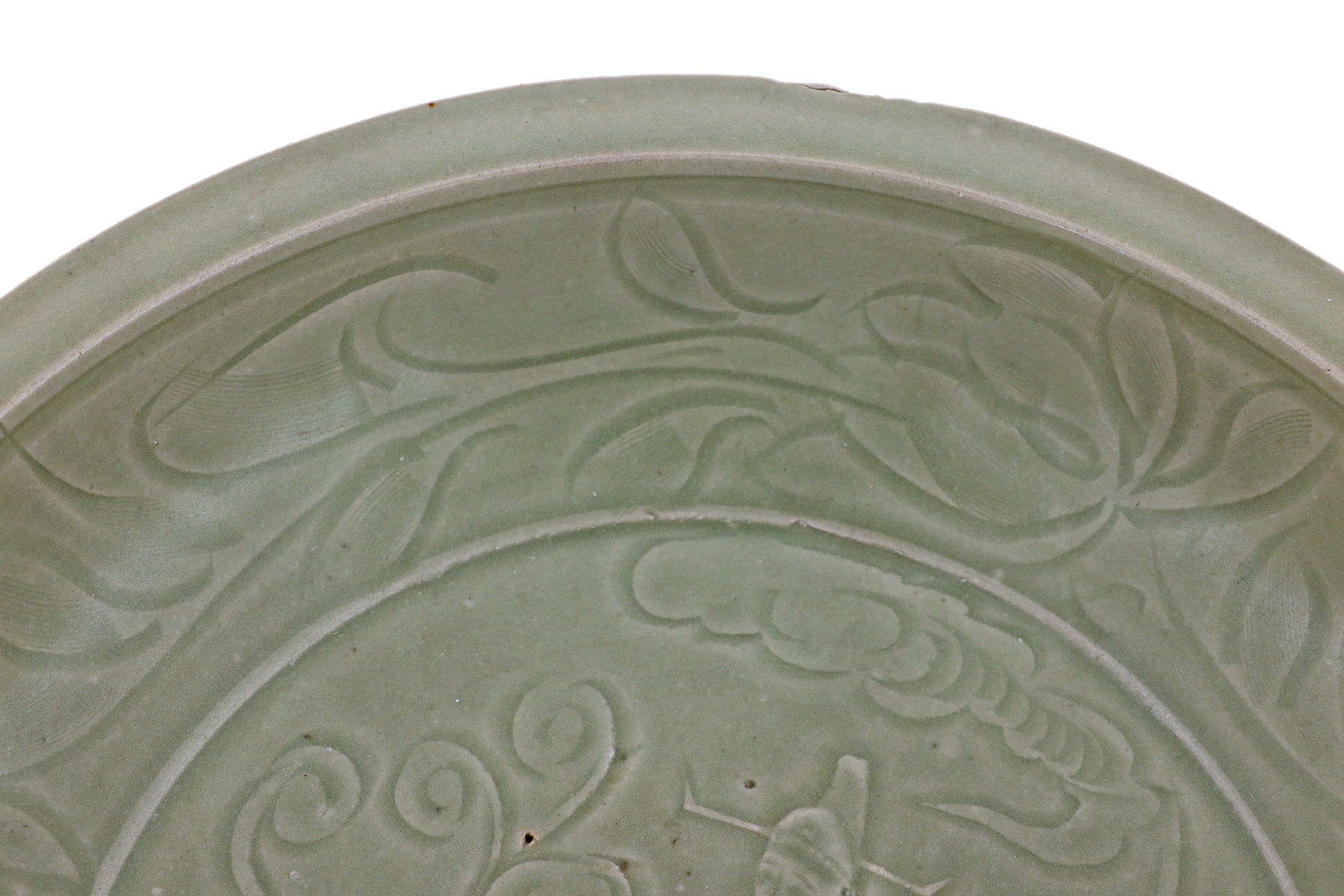 A LARGE CARVED LONGQUAN CELADON DISH