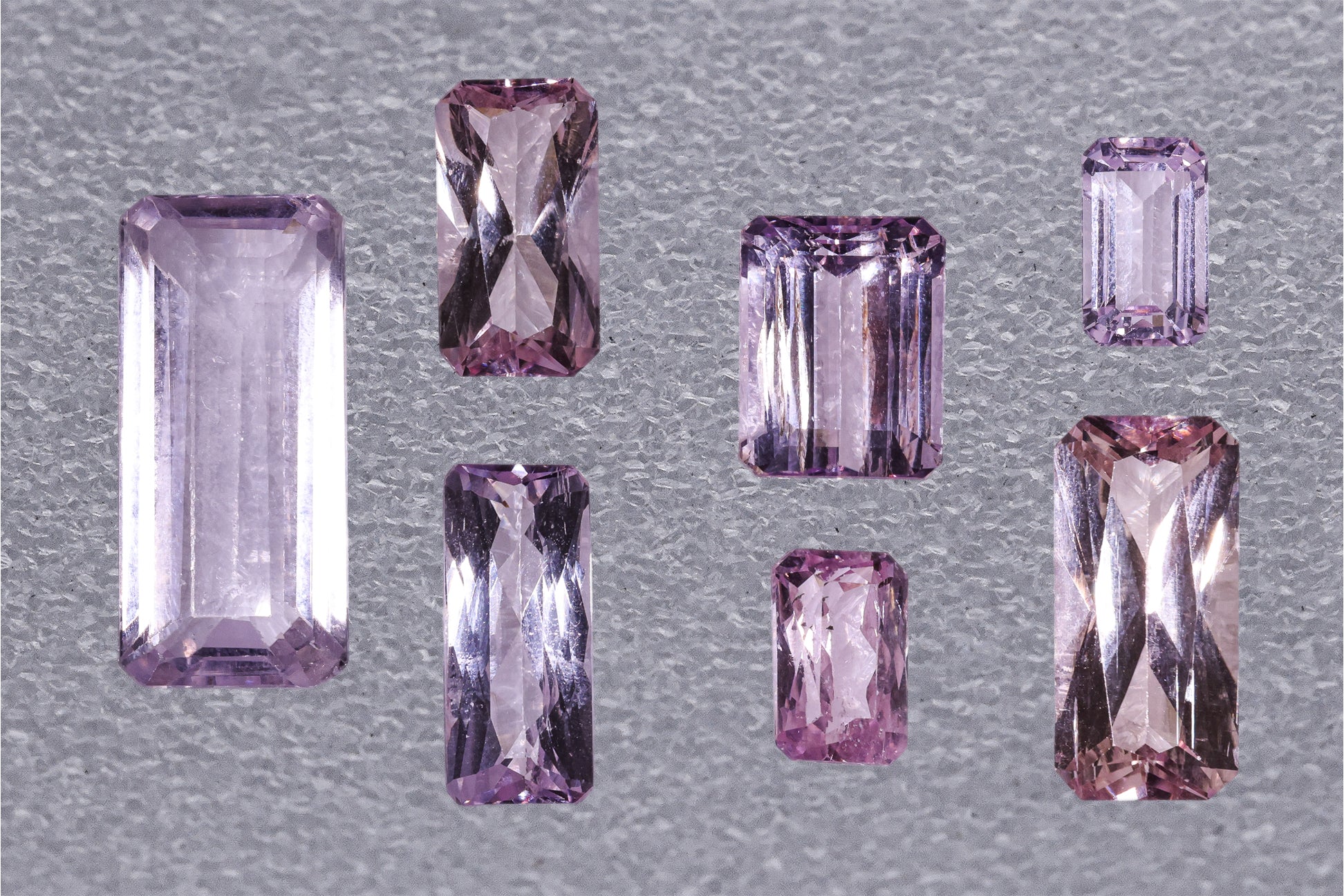 A GROUP OF SEVEN UNMOUNTED KUNZITES