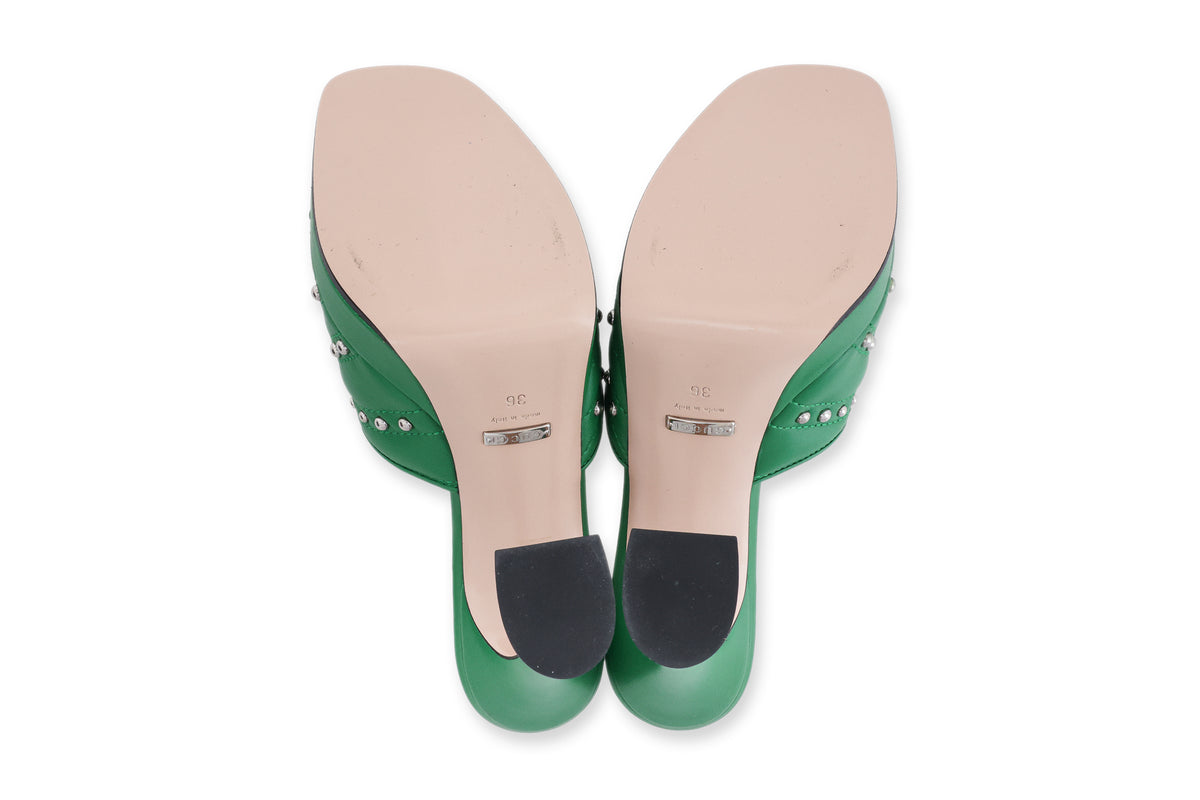 GUCCI - A PAIR OF GREEN STUDDED AND QUILTED HEELS