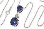 A BLUE SAPPHIRE AND DIAMOND PENDANT ON CHAIN