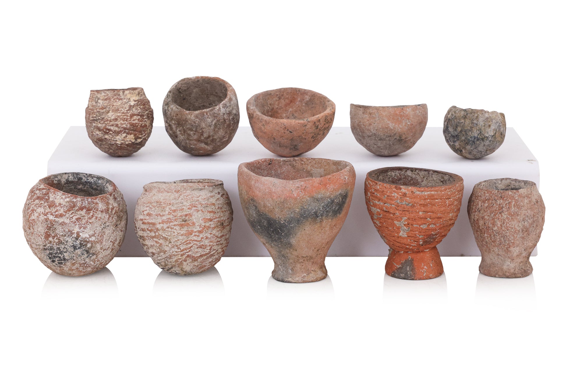 A GROUP OF TEN MINIATURE BAN CHIANG STYLE POTTERY VESSELS
