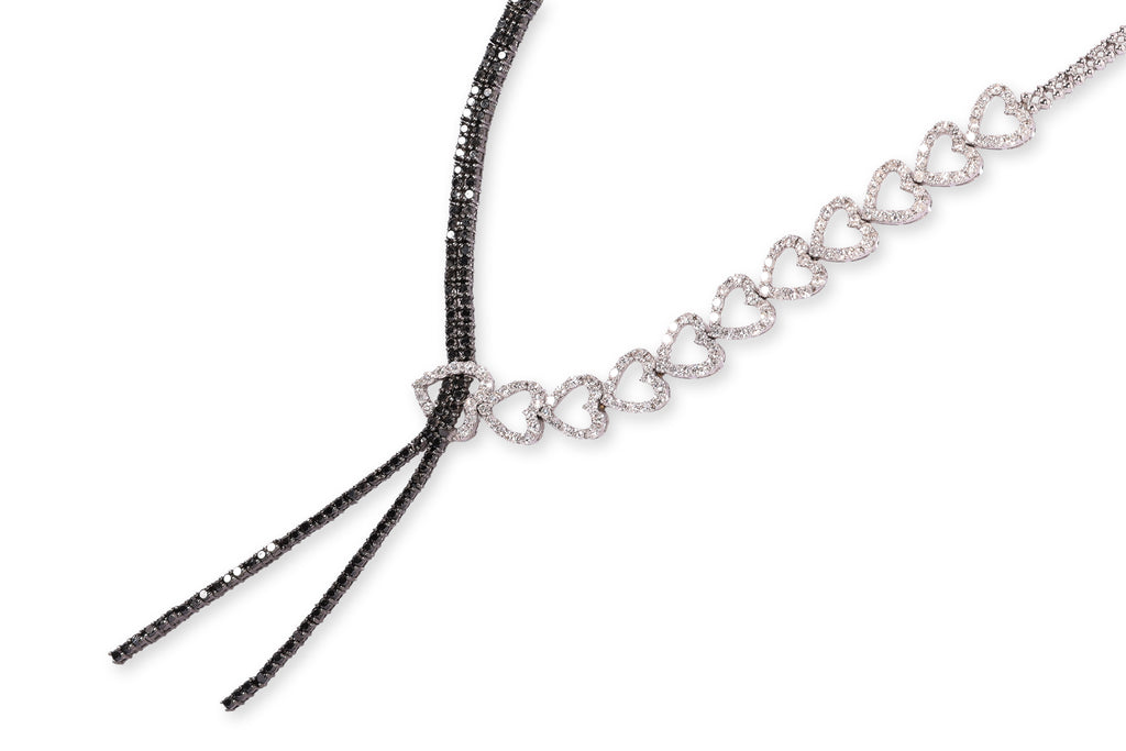 A DIAMOND AND BLACK DIAMOND TWO TONE 'RIBBON' NECKLACE
