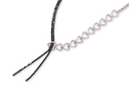 A DIAMOND AND BLACK DIAMOND TWO TONE 'RIBBON' NECKLACE