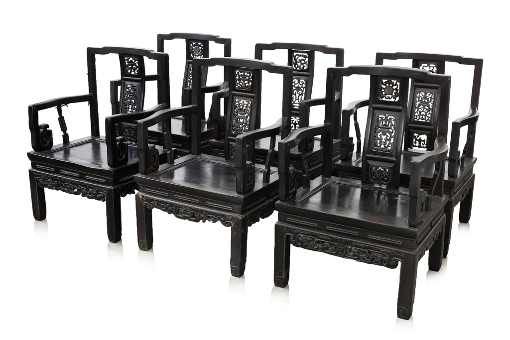 A SET OF SIX SIMILAR CHINESE CARVED HARDWOOD ARMCHAIRS