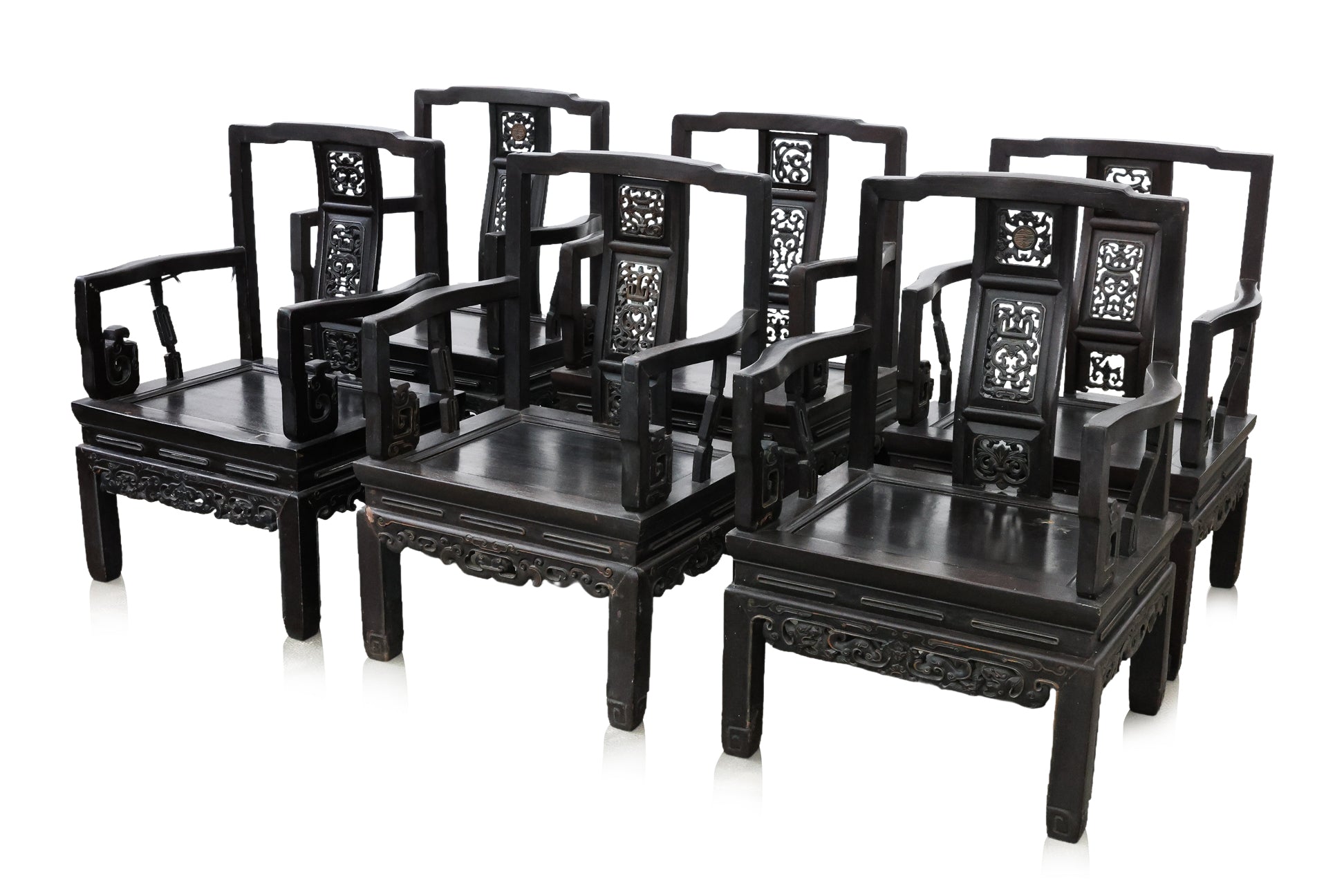 A SET OF SIX SIMILAR CHINESE CARVED HARDWOOD ARMCHAIRS
