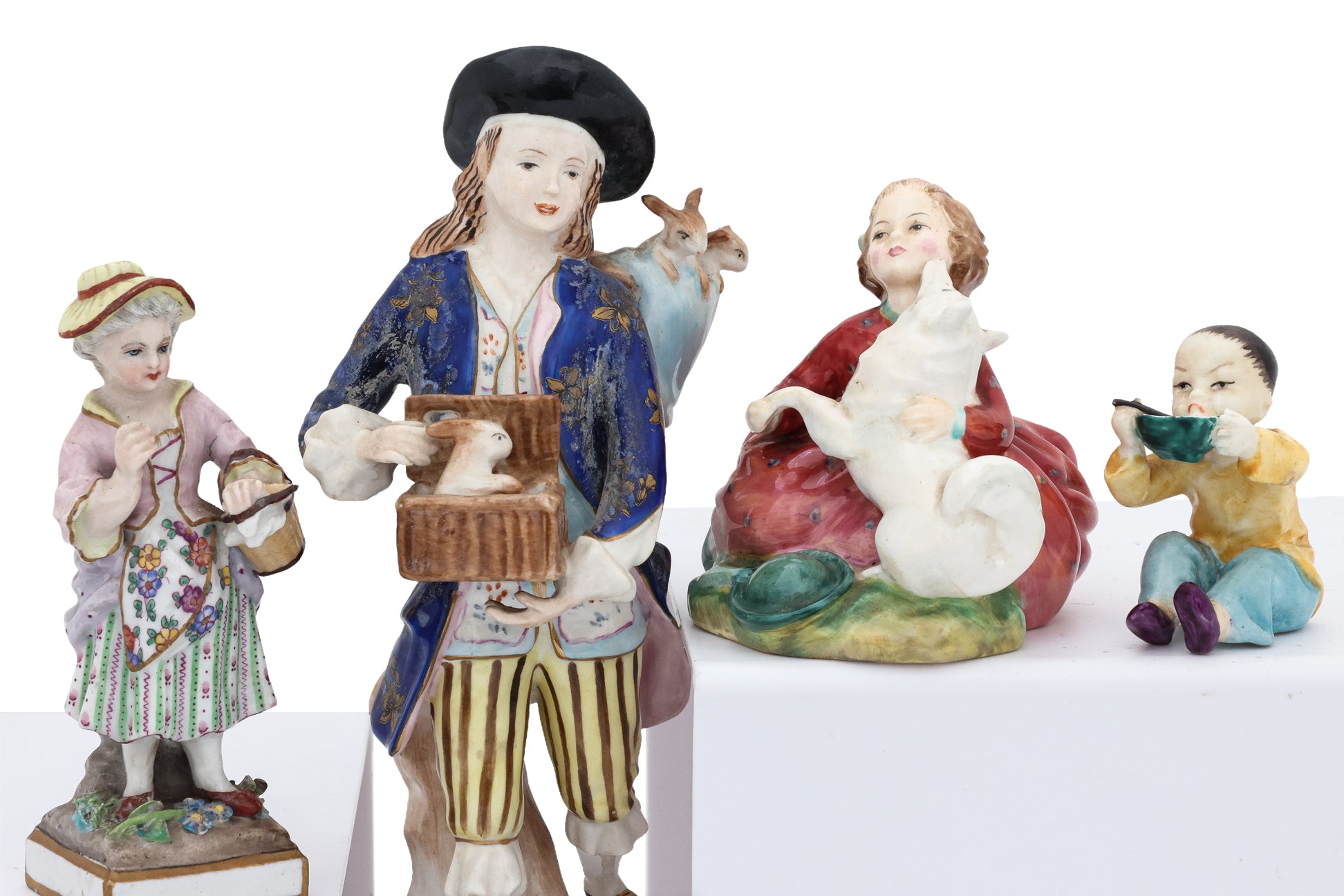 A GROUP OF SIX PORCELAIN FIGURINES AND ORNAMENTS