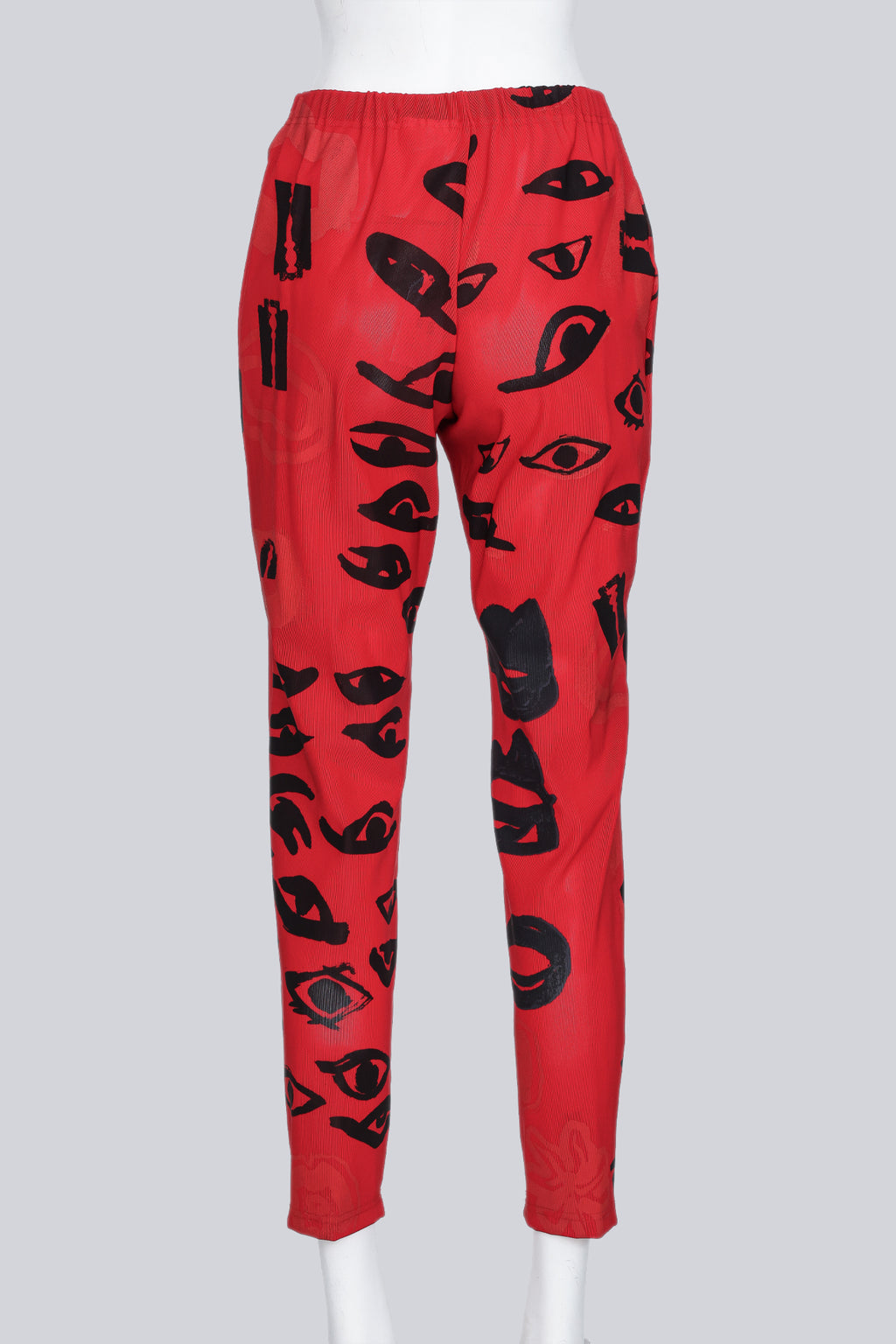 COMME DES GARCONS - A PAIR OF 2000 RED AND BLACK GRAPHIC PRINT PANTS