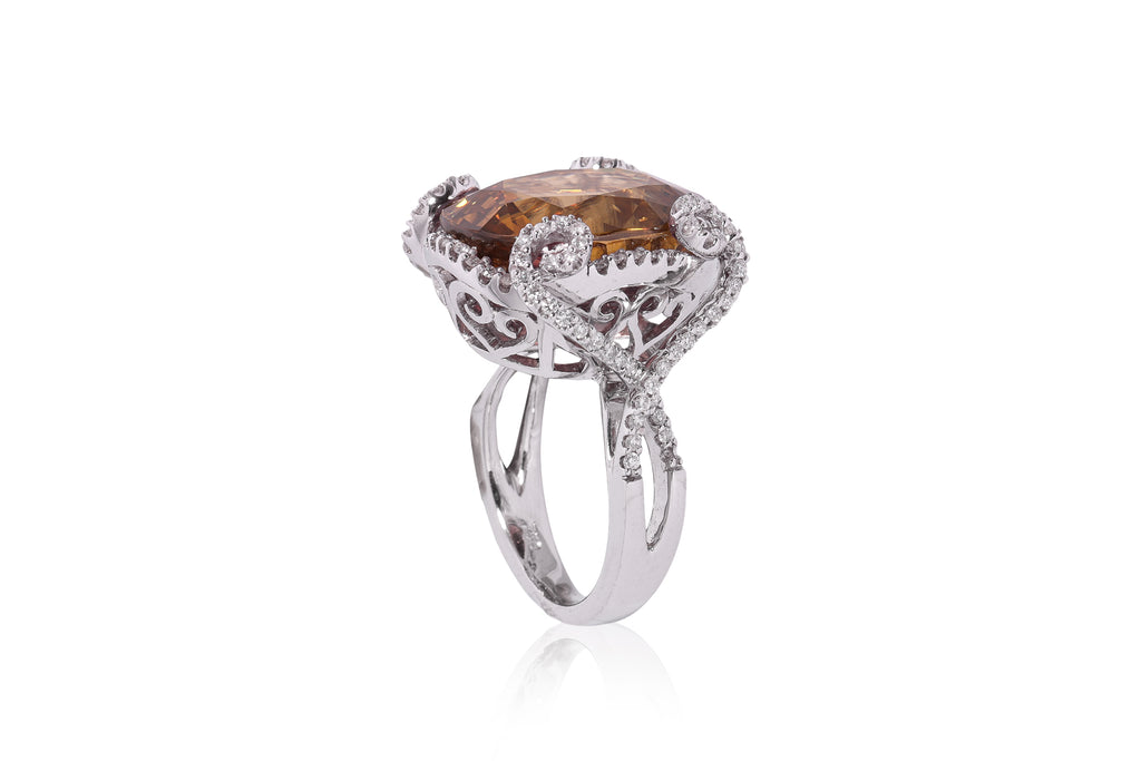 A LARGE ZIRCON AND DIAMOND RING
