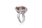 A LARGE ZIRCON AND DIAMOND RING