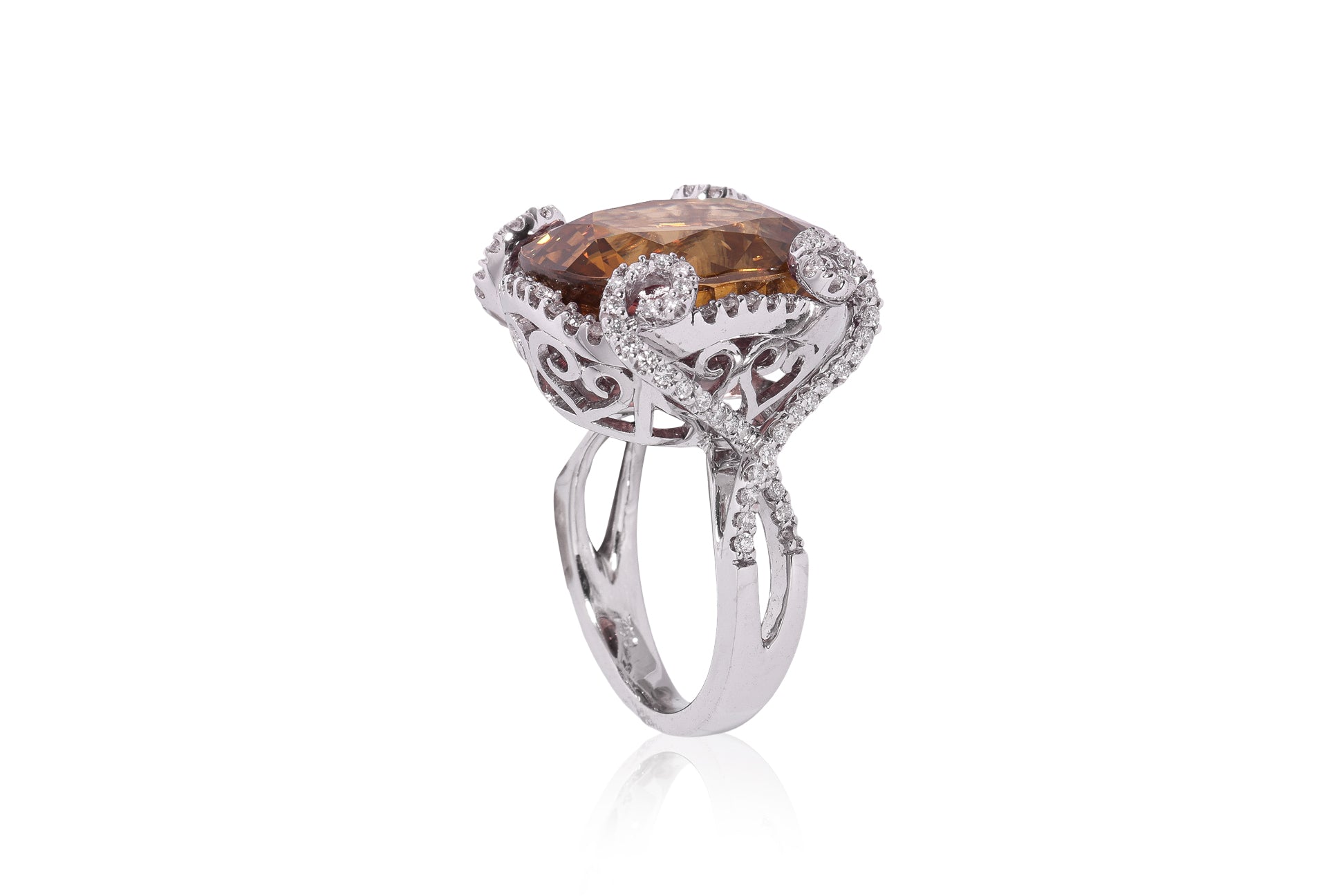A LARGE ZIRCON AND DIAMOND RING