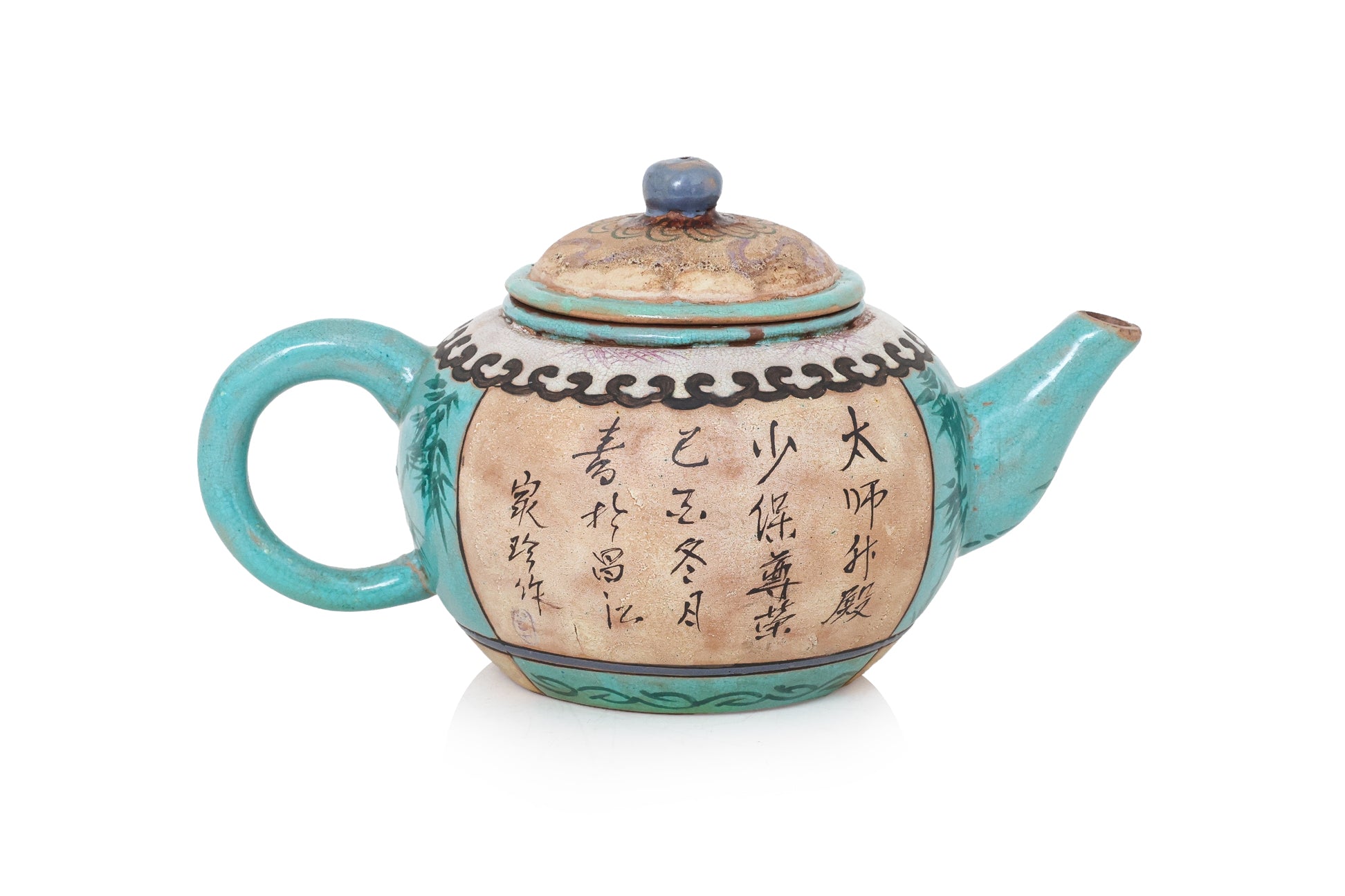 AN ENAMELLED POTTERY TEAPOT AND COVER