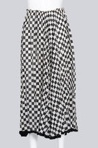 COMME DES GARCONS - A BLACK AND WHITE CHECKERED SKIRT