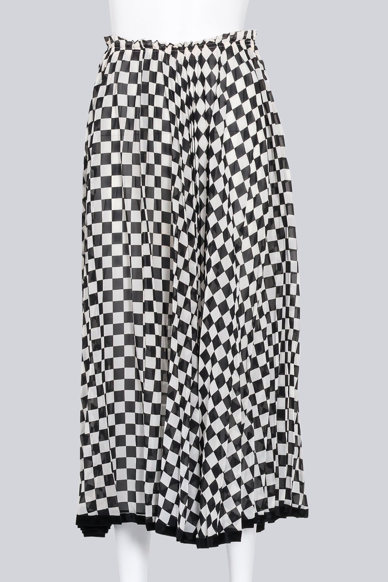 COMME DES GARCONS - A BLACK AND WHITE CHECKERED SKIRT