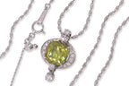 A SPHENE AND DIAMOND PENDANT ON CHAIN