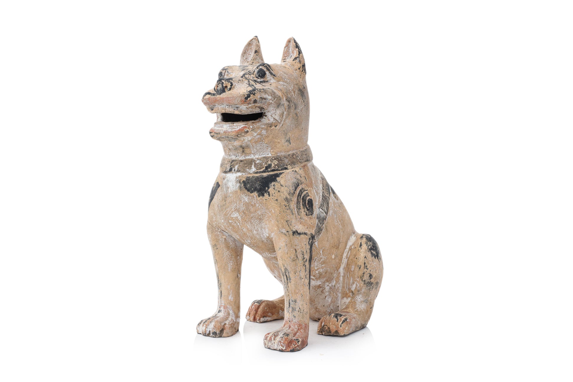 A PAINTED EARTHENWARE POTTERY MODEL OF A DOG